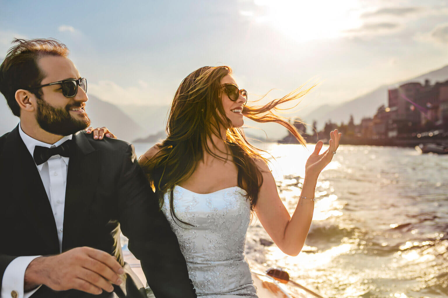 A couple enjoying the sunset on a vintage wooden taxi boat.